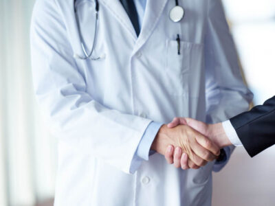 1693664548 doctor handshake with a patient at doctors bright modern office in hospital 4